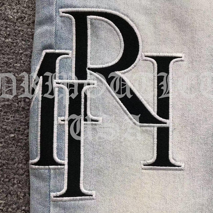 Amiri Blue Bleached Distressed Logo Skinny Jeans